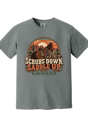 A heather gray short-sleeve crewneck t-shirt featuring a retro western graphic of a horse and rider with the text 'SCRUBS DOWN, SADDLE UP' and 'survival ride club'.